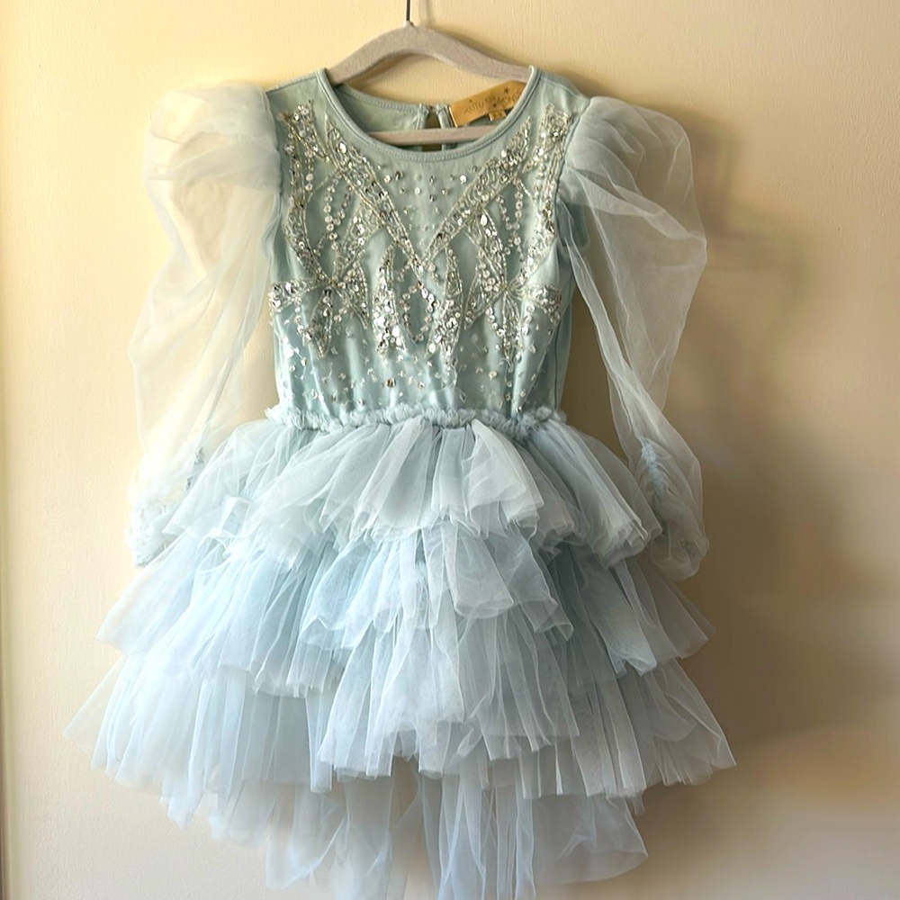 In a lovely shade of powder blue, this tutu dress for girls is by Tutu du Monde.